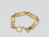 Monet Brushed Gold Tone Bamboo Link Bracelet  - Hers and His Treasures